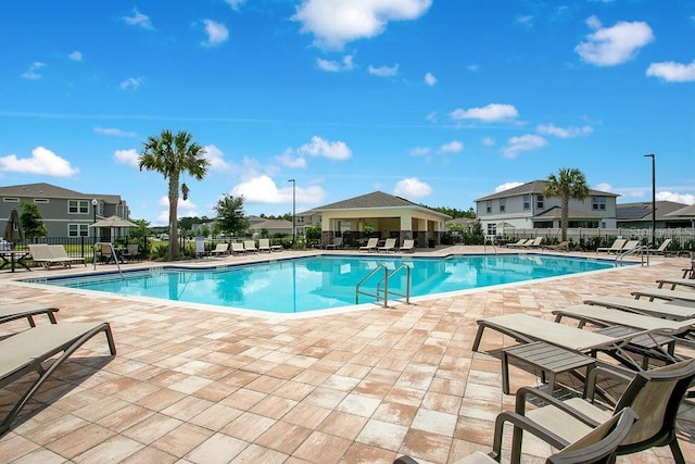 10940 Leafshore Loop, Orlando, FL 32829 - community pool with fence and a patio