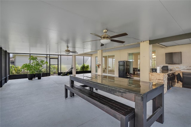 view of patio / terrace with exterior kitchen and a ceiling fan
