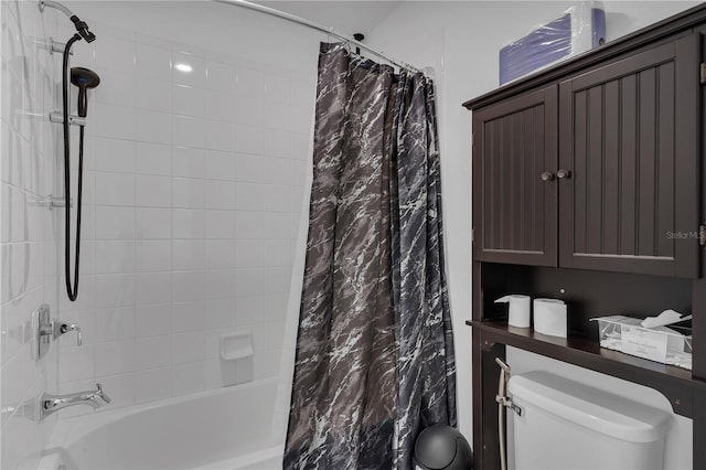 full bath featuring shower / bath combo with shower curtain and toilet