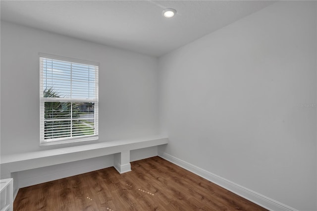 interior space with wood finished floors, baseboards, and recessed lighting