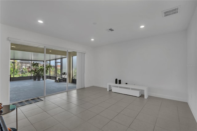spare room with recessed lighting, tile patterned floors, and baseboards