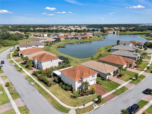 aerial view of residential area featuring a nearby body of water