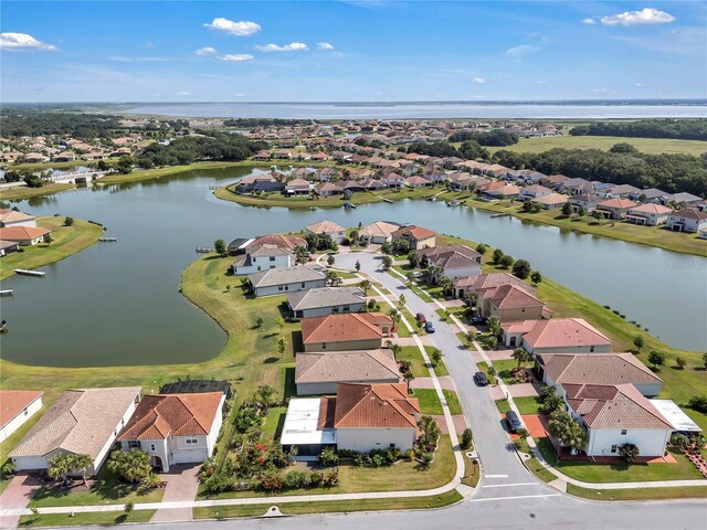 aerial perspective of suburban area with a large body of water
