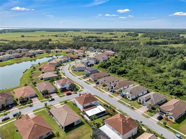 aerial view of residential area with a large body of water