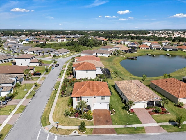 aerial view of residential area with a large body of water