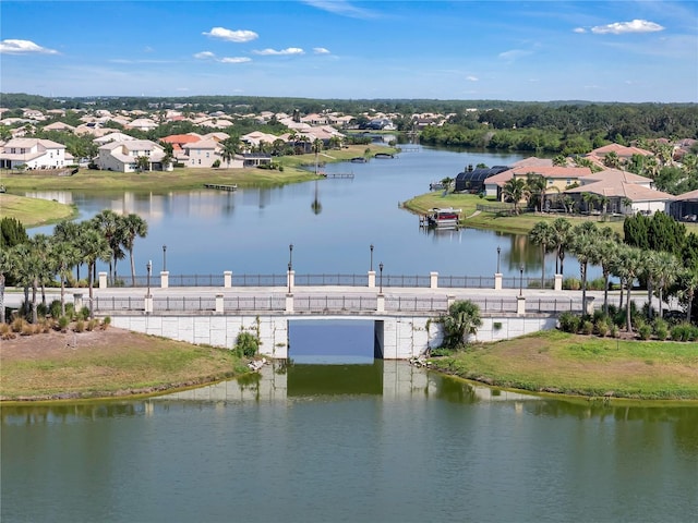 water view with nearby suburban area and fence