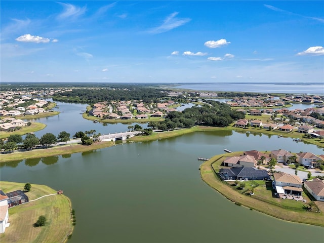aerial perspective of suburban area featuring a large body of water