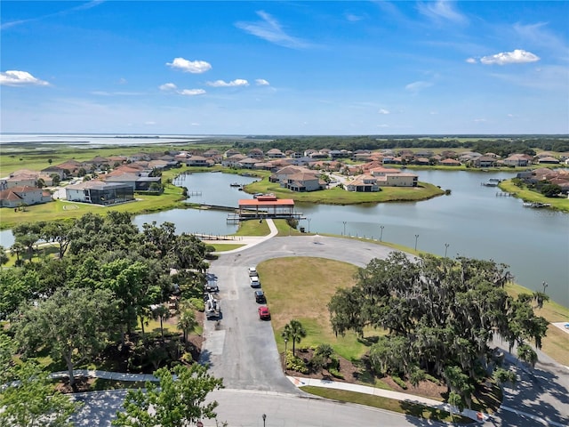 view of property location featuring nearby suburban area and a large body of water