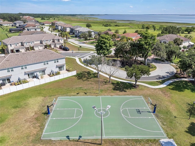 aerial perspective of suburban area featuring a large body of water