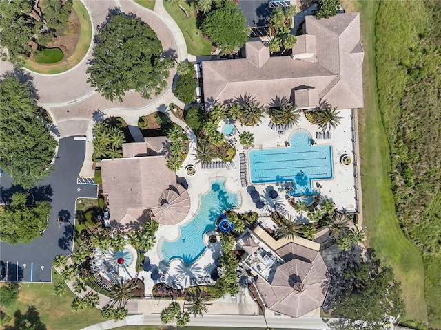 aerial view of property and surrounding area with a pool