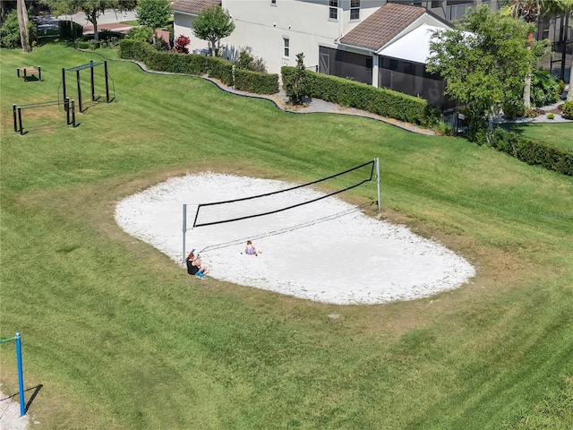 view of property's community featuring volleyball court and a yard