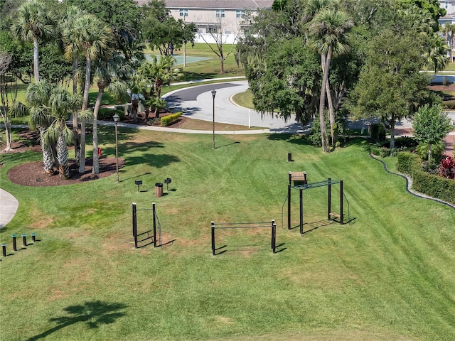 view of property's community with a lawn