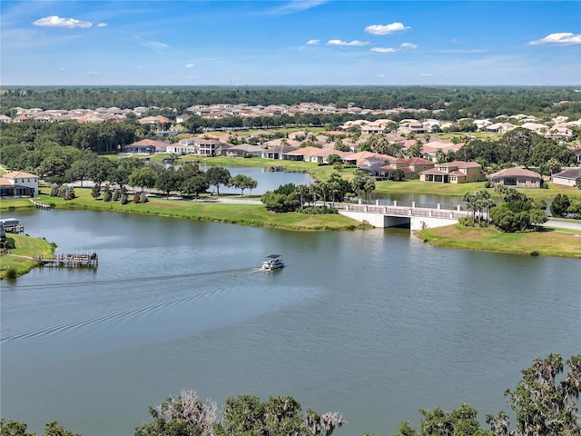 water view with nearby suburban area and a tree filled landscape