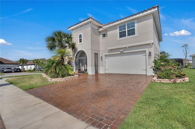 mediterranean / spanish-style house featuring a garage, stucco siding, decorative driveway, and a front lawn