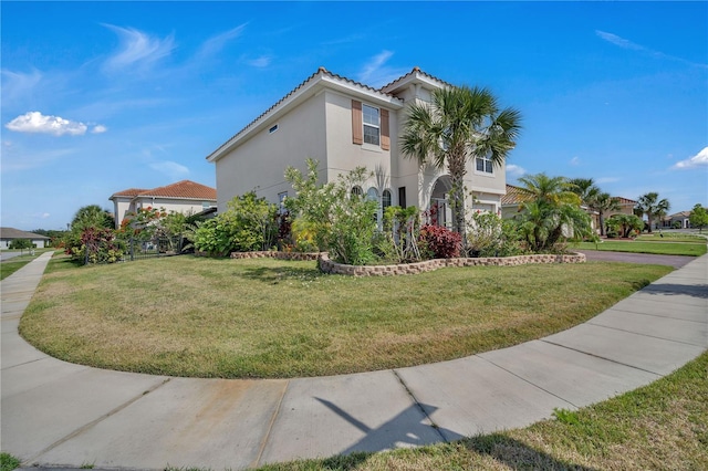 view of home's exterior featuring a tiled roof, stucco siding, and a lawn