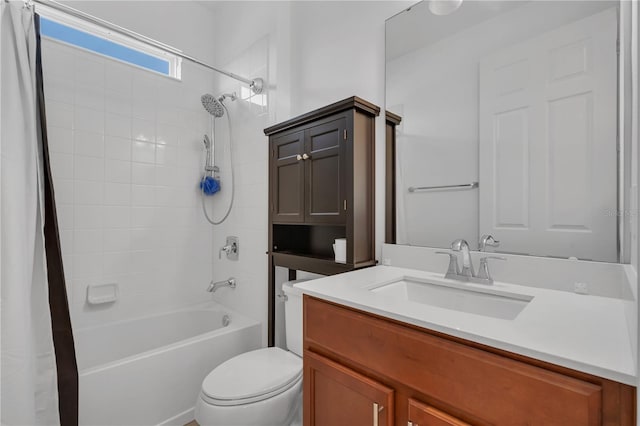 bathroom featuring toilet, shower / tub combo with curtain, and vanity