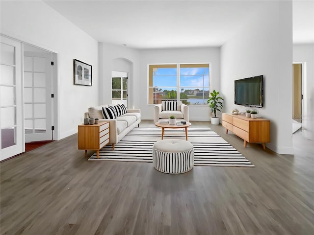 5154 51st Ln W, Bradenton, FL 34210 - living room with wood finished floors, baseboards, and arched walkways