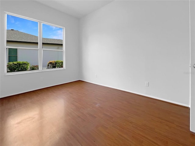 5154 51st Ln W, Bradenton, FL 34210 - empty room with wood finished floors and baseboards