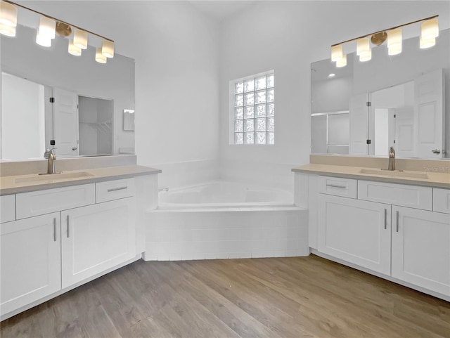 5154 51st Ln W, Bradenton, FL 34210 - full bathroom featuring a bath, two vanities, and a sink