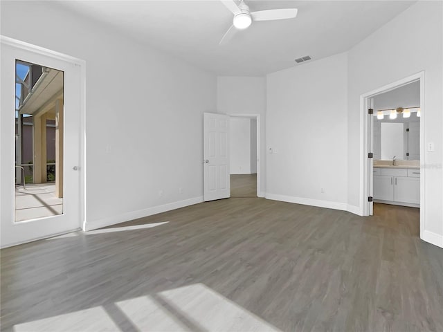 5154 51st Ln W, Bradenton, FL 34210 - unfurnished bedroom featuring baseboards, ensuite bathroom, visible vents, a sink, and wood finished floors
