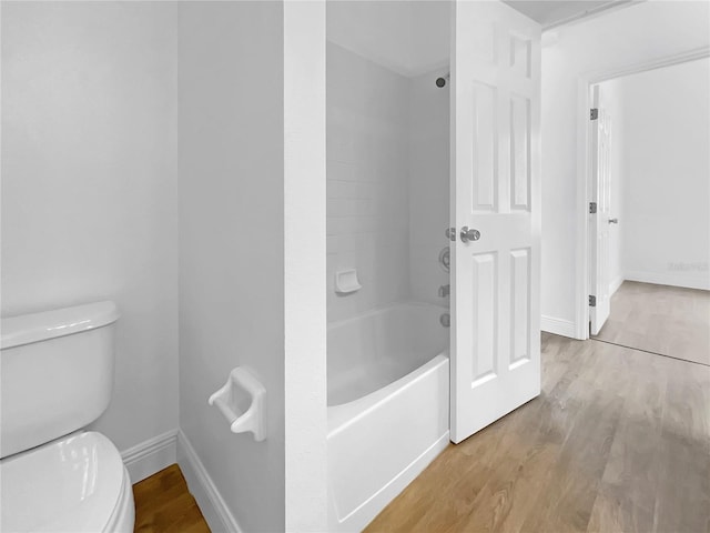 5154 51st Ln W, Bradenton, FL 34210 - bathroom featuring toilet, baseboards, and wood finished floors