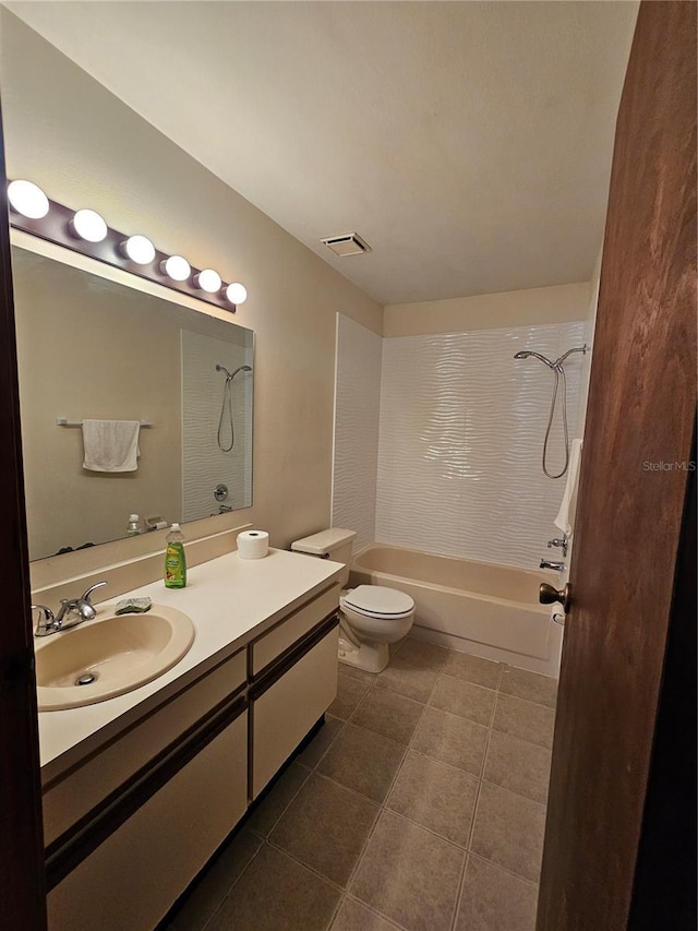 full bathroom featuring toilet, tile patterned flooring,  shower combination, and vanity