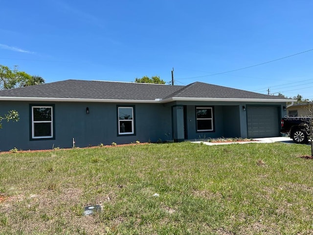 ranch-style home with a front lawn, stucco siding, and a garage