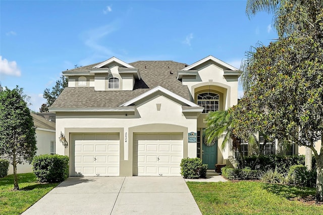 2624 Daulby St, Kissimmee, FL 34747 - view of front of property with concrete driveway, roof with shingles, stucco siding, and a garage