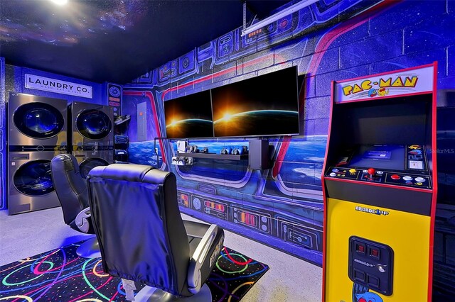 2624 Daulby St, Kissimmee, FL 34747 - playroom featuring stacked washing machine and dryer