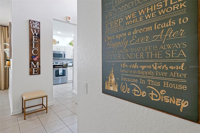 2624 Daulby St, Kissimmee, FL 34747 - hallway featuring tile patterned flooring