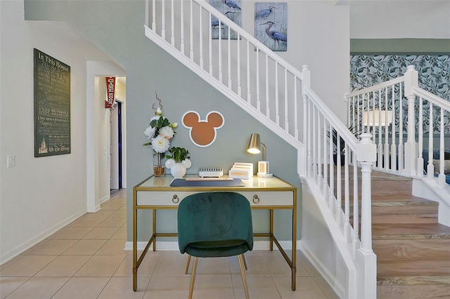 2624 Daulby St, Kissimmee, FL 34747 - stairs with tile patterned flooring, baseboards, and a towering ceiling