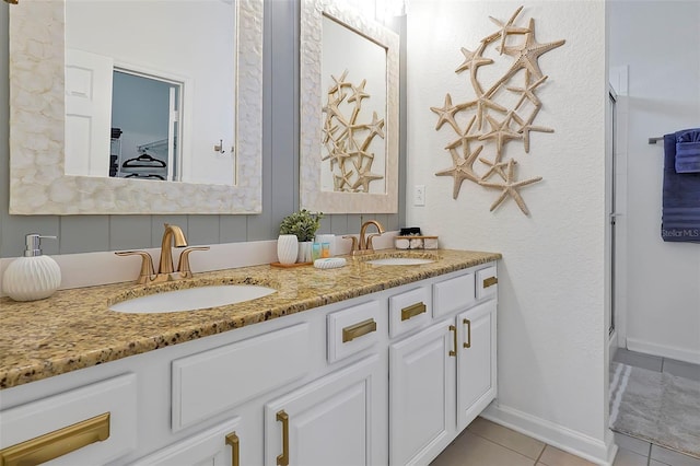 2624 Daulby St, Kissimmee, FL 34747 - bathroom with tile patterned floors, double vanity, and an enclosed shower