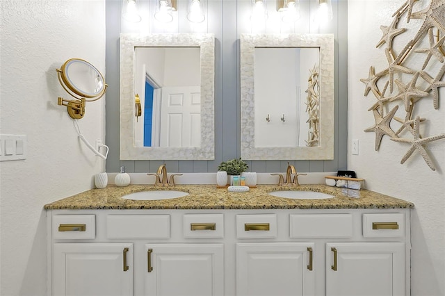2624 Daulby St, Kissimmee, FL 34747 - full bath featuring double vanity and a textured wall
