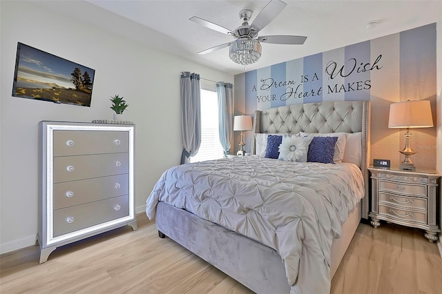 2624 Daulby St, Kissimmee, FL 34747 - bedroom with wood finished floors, baseboards, and ceiling fan