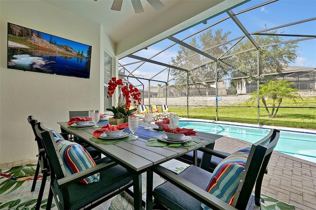 2624 Daulby St, Kissimmee, FL 34747 - view of patio with a ceiling fan, an outdoor pool, glass enclosure, and outdoor dining area