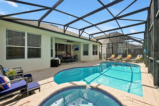 2624 Daulby St, Kissimmee, FL 34747 - view of swimming pool with a pool with connected hot tub, a patio, a ceiling fan, and glass enclosure