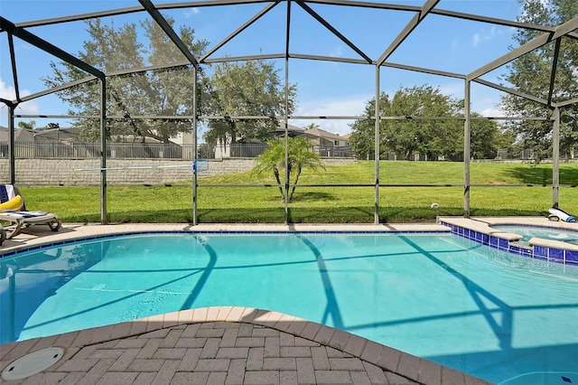 2624 Daulby St, Kissimmee, FL 34747 - view of pool featuring a lawn, a lanai, a pool with connected hot tub, and a patio