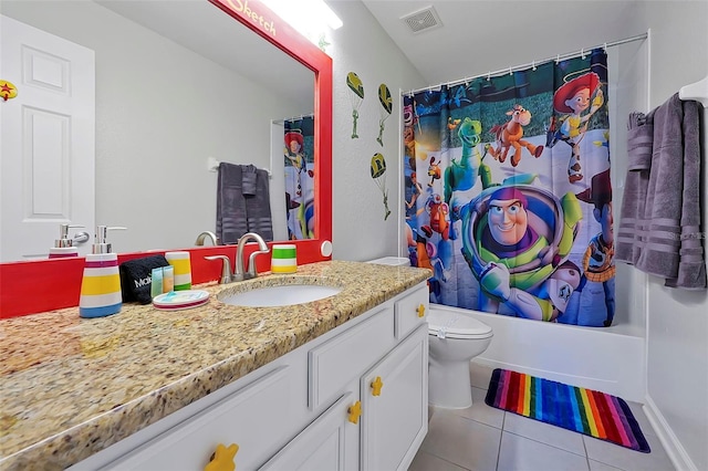 2624 Daulby St, Kissimmee, FL 34747 - full bath with tile patterned flooring, toilet, vanity, and shower / tub combo