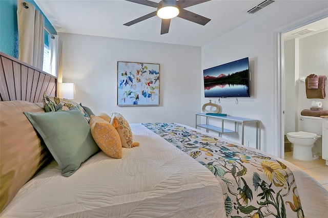 2624 Daulby St, Kissimmee, FL 34747 - bedroom featuring connected bathroom, ceiling fan, and tile patterned floors