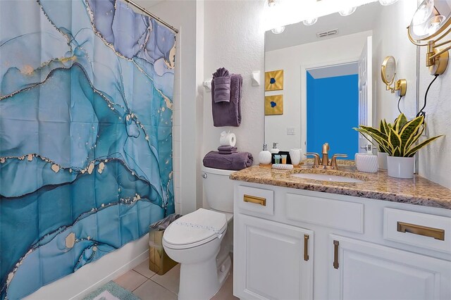 2624 Daulby St, Kissimmee, FL 34747 - bathroom featuring tile patterned floors, shower / bath combination with curtain, vanity, and toilet