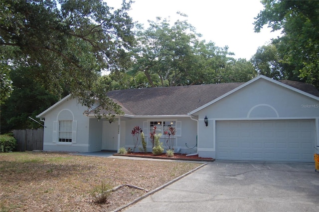 1644 Cypress Woods Cir, Saint Cloud, FL 34772 - ranch-style house featuring fence, a garage, stucco siding, concrete driveway, and roof with shingles