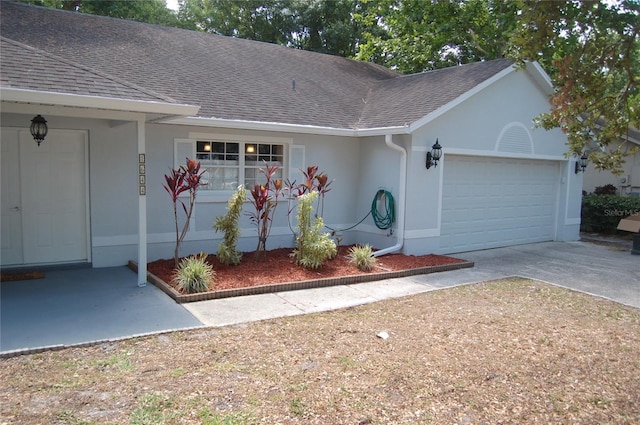 1644 Cypress Woods Cir, Saint Cloud, FL 34772 - single story home featuring a garage, concrete driveway, a shingled roof, and stucco siding