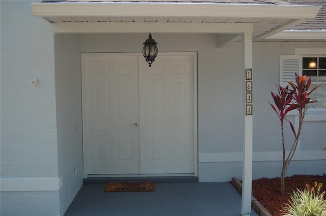 1644 Cypress Woods Cir, Saint Cloud, FL 34772 - doorway to property featuring stucco siding