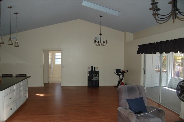 1644 Cypress Woods Cir, Saint Cloud, FL 34772 - interior space with baseboards, dark wood-style flooring, an inviting chandelier, and high vaulted ceiling