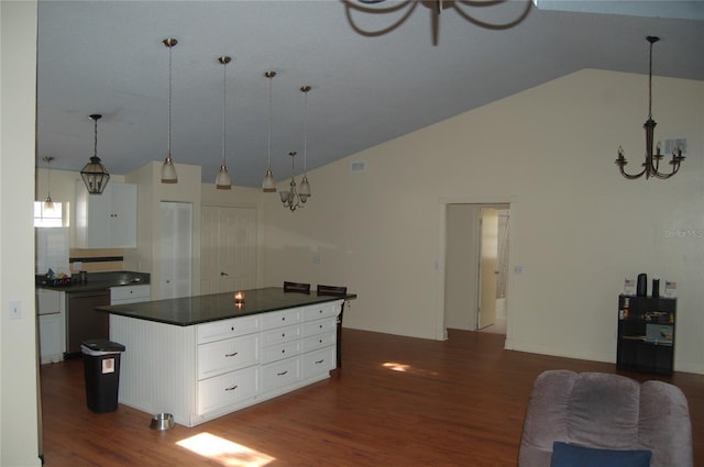 1644 Cypress Woods Cir, Saint Cloud, FL 34772 - kitchen with an inviting chandelier, dark countertops, dishwasher, vaulted ceiling, and dark wood-style floors