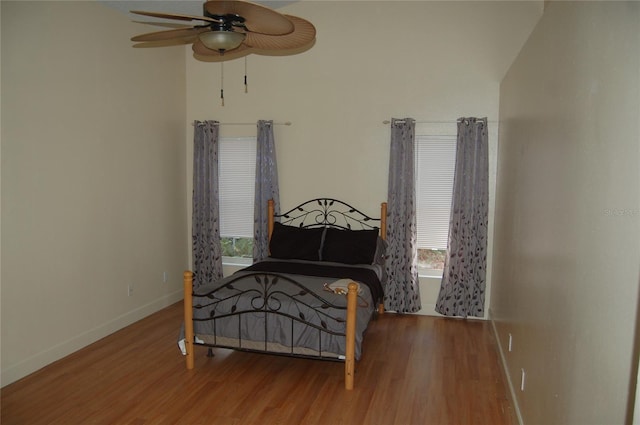 1644 Cypress Woods Cir, Saint Cloud, FL 34772 - bedroom featuring baseboards, a ceiling fan, and wood finished floors