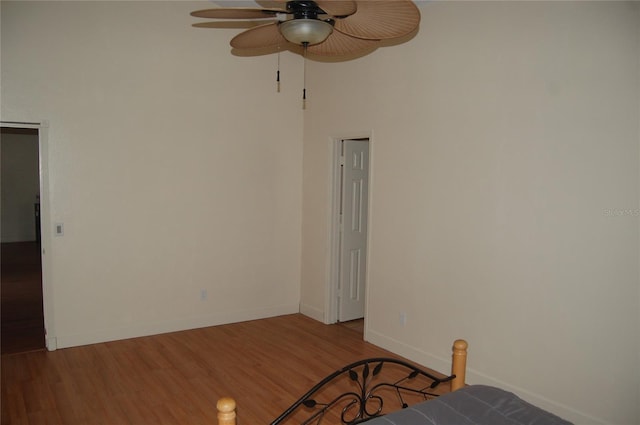 1644 Cypress Woods Cir, Saint Cloud, FL 34772 - unfurnished bedroom with ceiling fan, baseboards, and wood finished floors