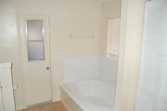 1644 Cypress Woods Cir, Saint Cloud, FL 34772 - full bathroom featuring tile patterned floors, a garden tub, and a closet