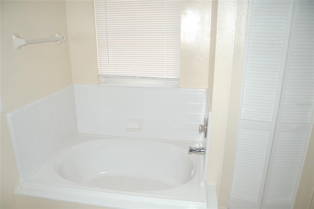 1644 Cypress Woods Cir, Saint Cloud, FL 34772 - bathroom with a bath and a closet