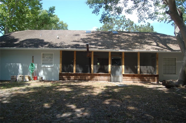 1644 Cypress Woods Cir, Saint Cloud, FL 34772 - back of property featuring a sunroom and a shingled roof